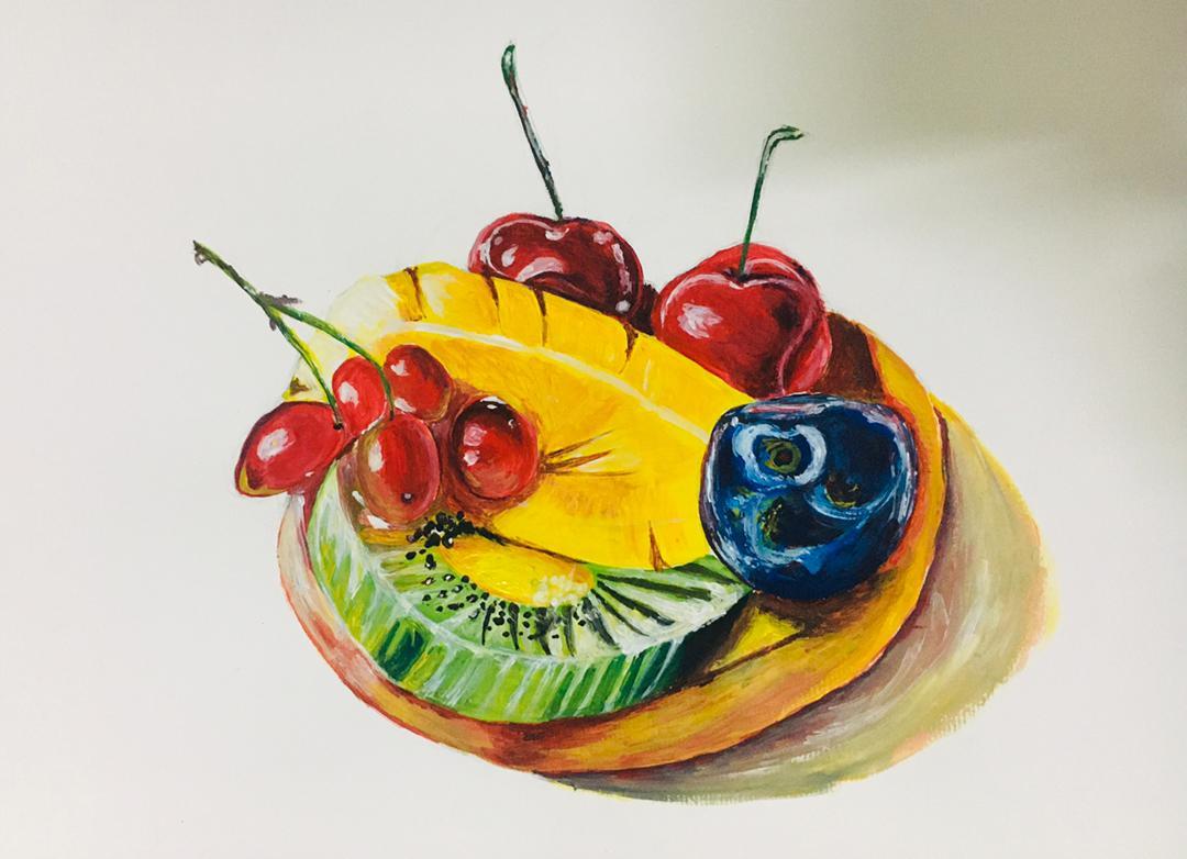 A bowl of sliced mango, kiwi, plum and cherries glowing against a soft grey ground