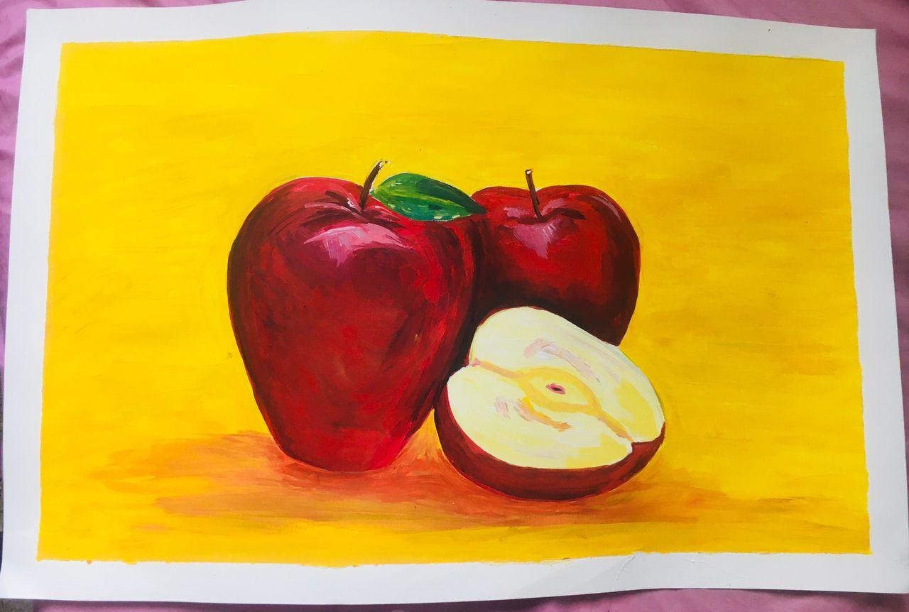 Two deep red apples and a cut half showing pale flesh, set against a saturated yellow ground