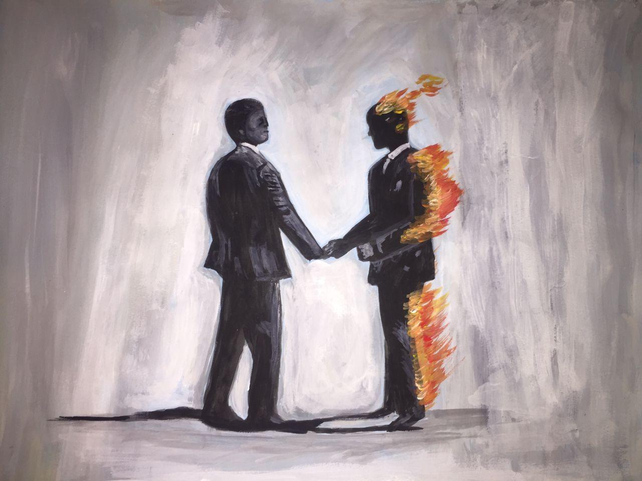 Two men in suits shaking hands; one is calmly being consumed by flame while the other feels nothing